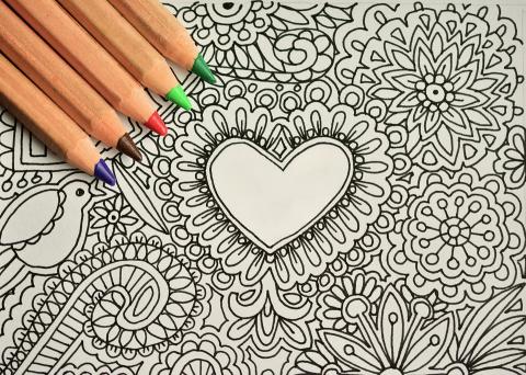 Colored pencils and blank coloring page