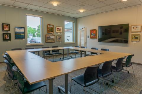 Lifelong Learning Room with tables and chairs in large square