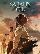 Little girl looking up at the sky with her dog by her side