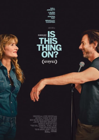 Two stand up comedians by a microphone